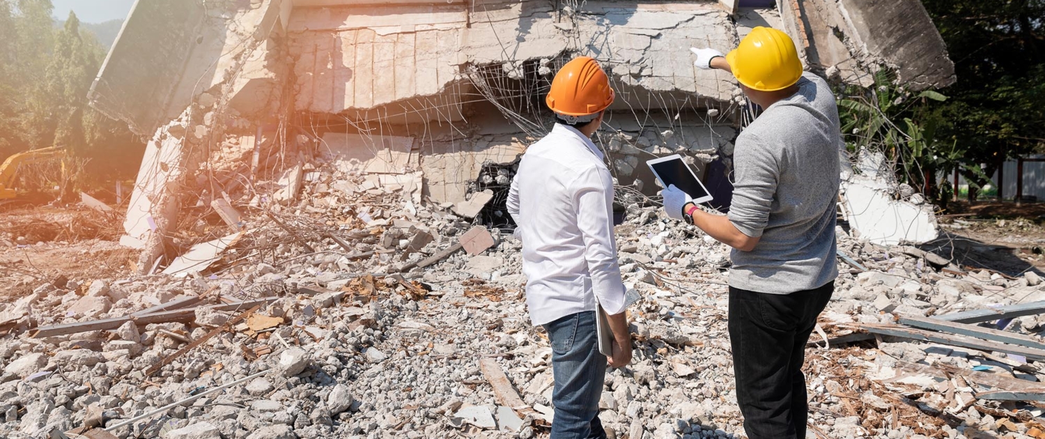 Workers Planning At Demolition Site