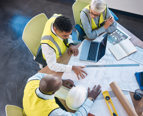 Construciton Workers Looking Over Plans
